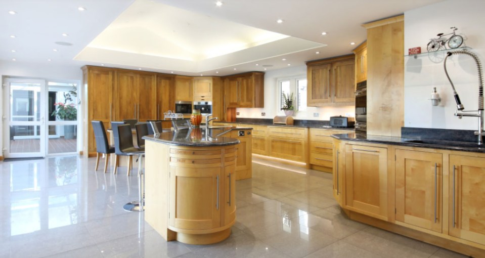 a kitchen with a bicycle on the wall above the sink