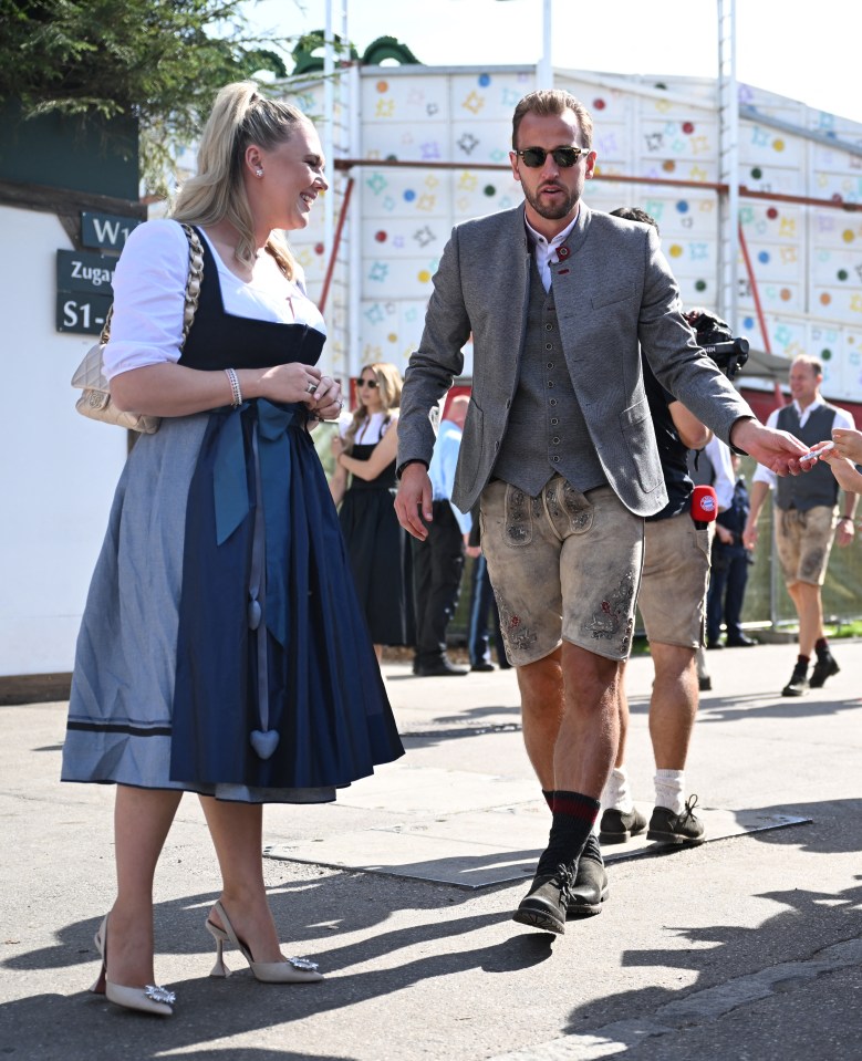 Harry donned a pair of leather lederhosen teamed with shin-high black socks, black leather boots and a grey jacket