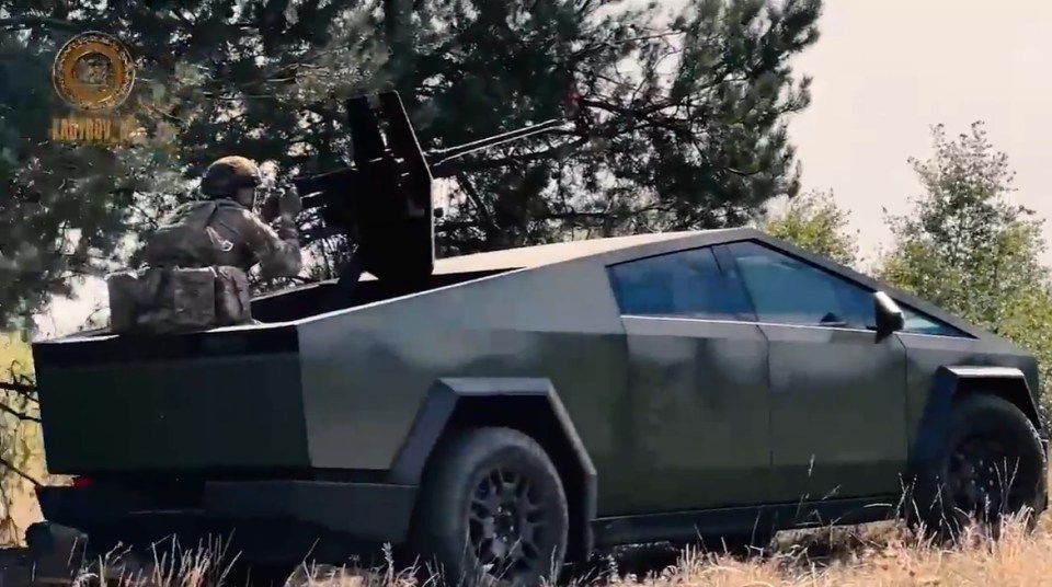 a military vehicle with a soldier on top of it