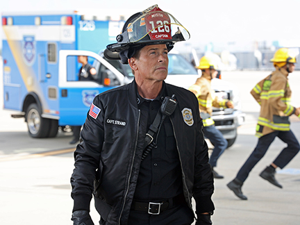 a man wearing a helmet with the number 126 on it