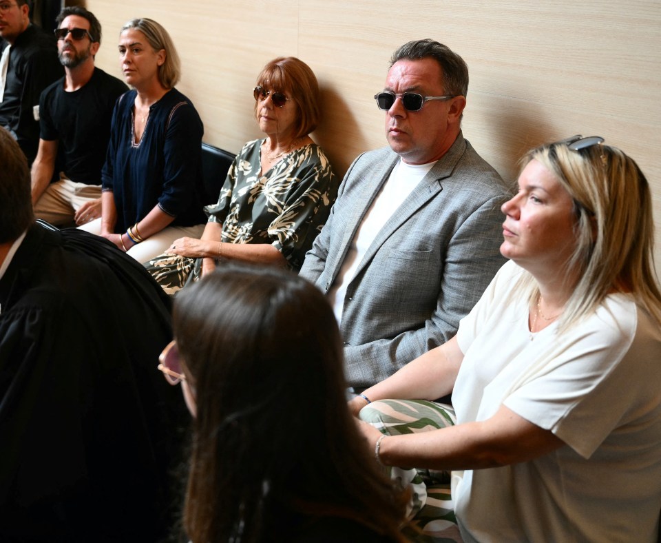 Gisele P. (C) sits next to her daughter Caroline Darian (3rdL), and her sons David P. (2ndR) with his wife Celine F. (R), and Florian P. (2ndL), at the courthouse during the trial of her husband accused of drugging her for nearly ten years and inviting strangers to rape her at their home in Mazan, a small town in the south of France, in Avignon, on September 2, 2024. The case involves 50 co-defendants. The defendants, 18 of whom are on remand, are men aged between 21 and 68 at the time of the events. (Photo by Christophe SIMON / AFP) (Photo by CHRISTOPHE SIMON/AFP via Getty Images)