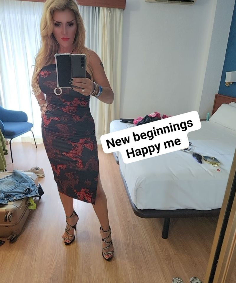 a woman taking a picture of herself in a mirror with the caption " new beginnings happy me "