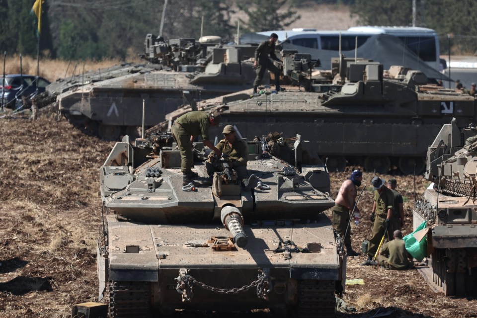 Israel tanks pictured on border on Saturday after Hezbollah's terror boss was wiped out