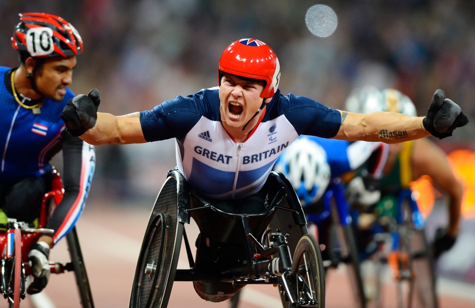 a man in a wheelchair is wearing a shirt that says great britain