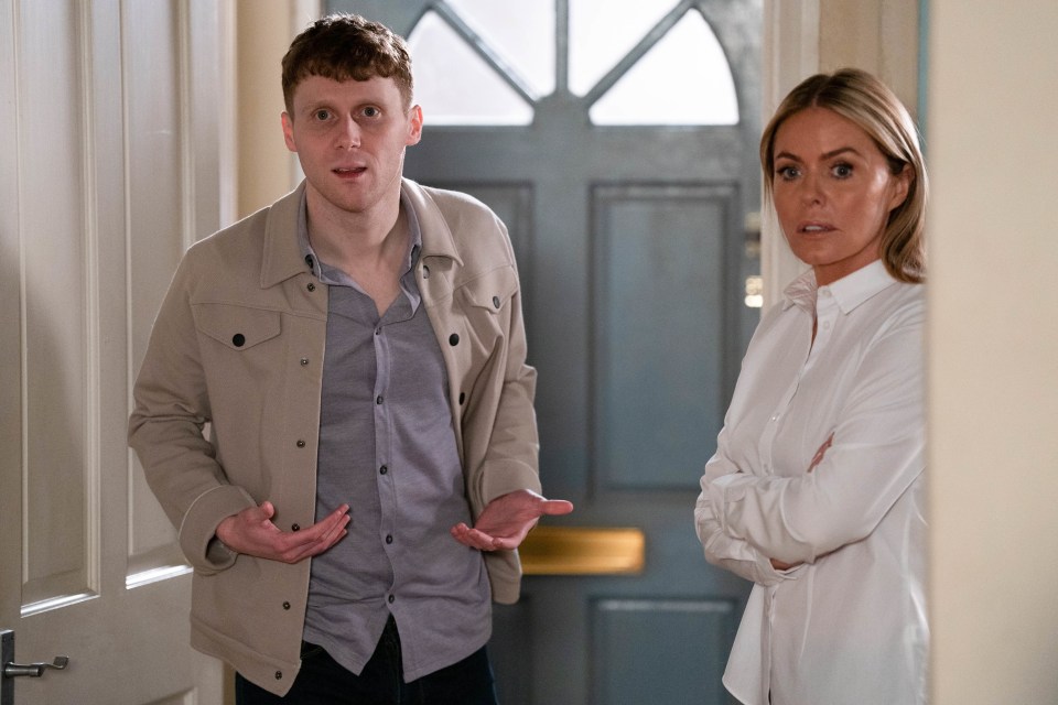 a man and a woman are standing in front of a door