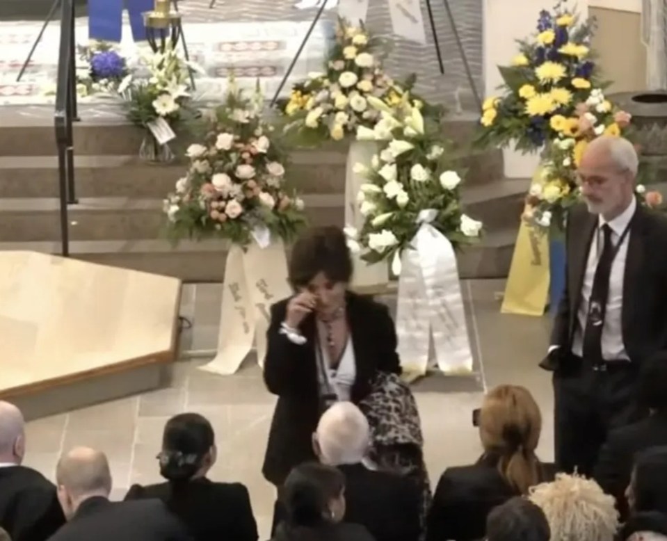 During a live stream of the funeral Nancy was seen wiping a tear