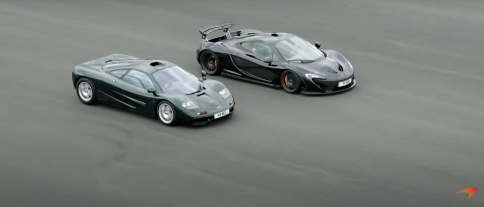 two mclaren cars are driving down a road