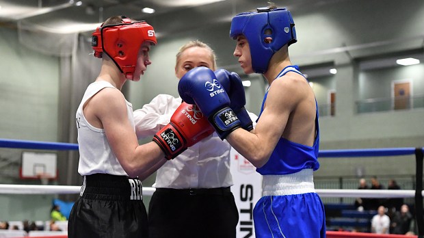 two boxers wearing sting gloves are fighting in a ring