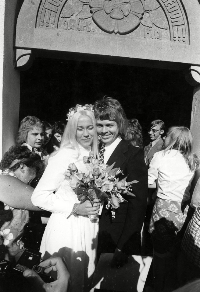 a black and white photo of a bride and groom