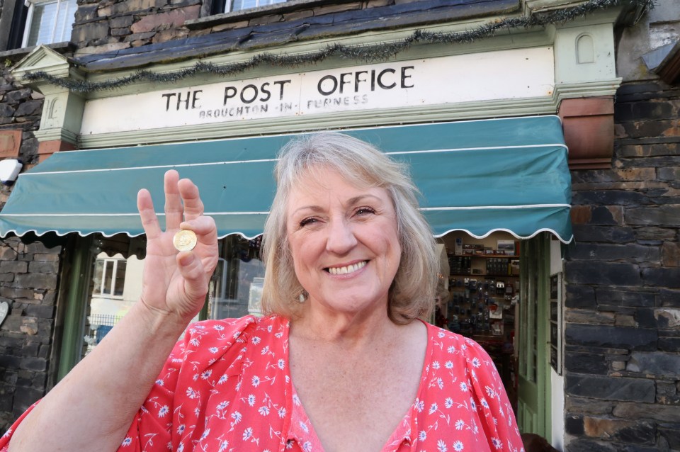 Diane holds up the rare coin that her staff had spotted