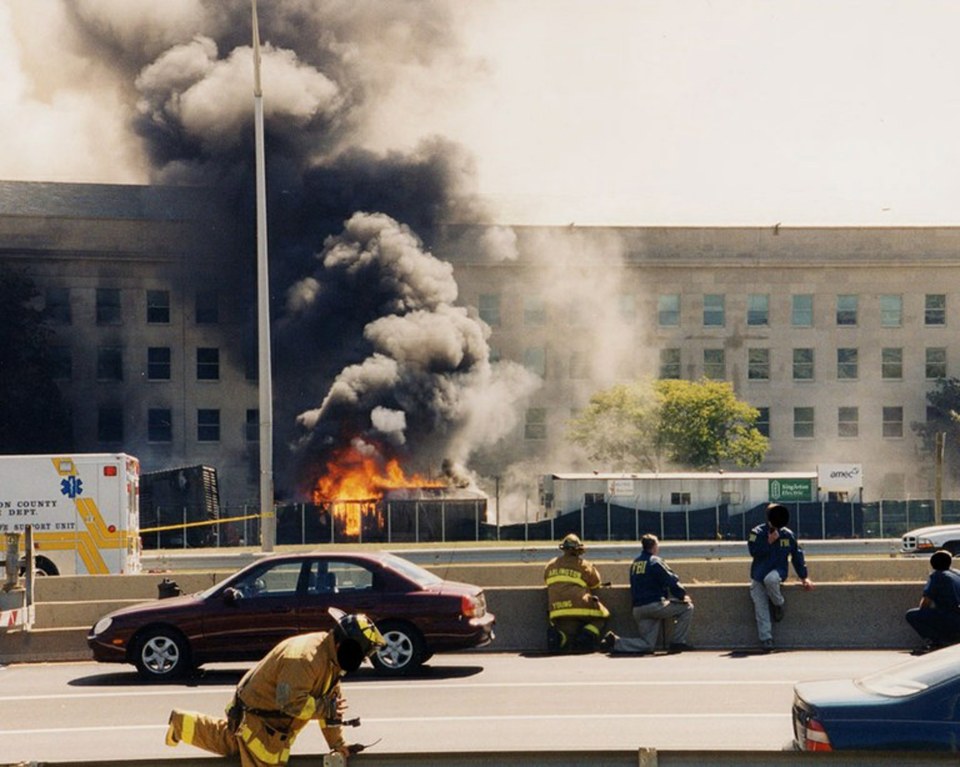 Smoke pours from the Pentagon after it was hit by a hijacked jet on 9/11