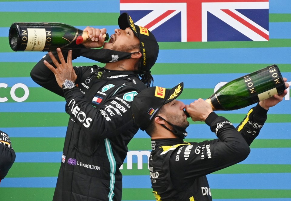 two men drinking from bottles of moet champagne