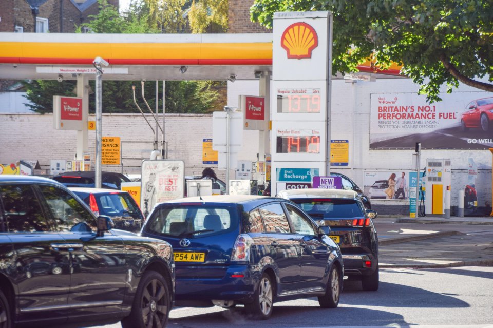 a shell gas station has a sign that says britain 's no.1 performance fuel