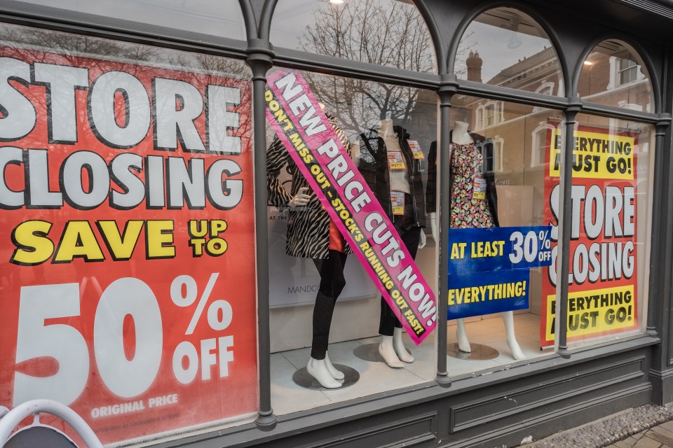 a store with a sign that says store closing