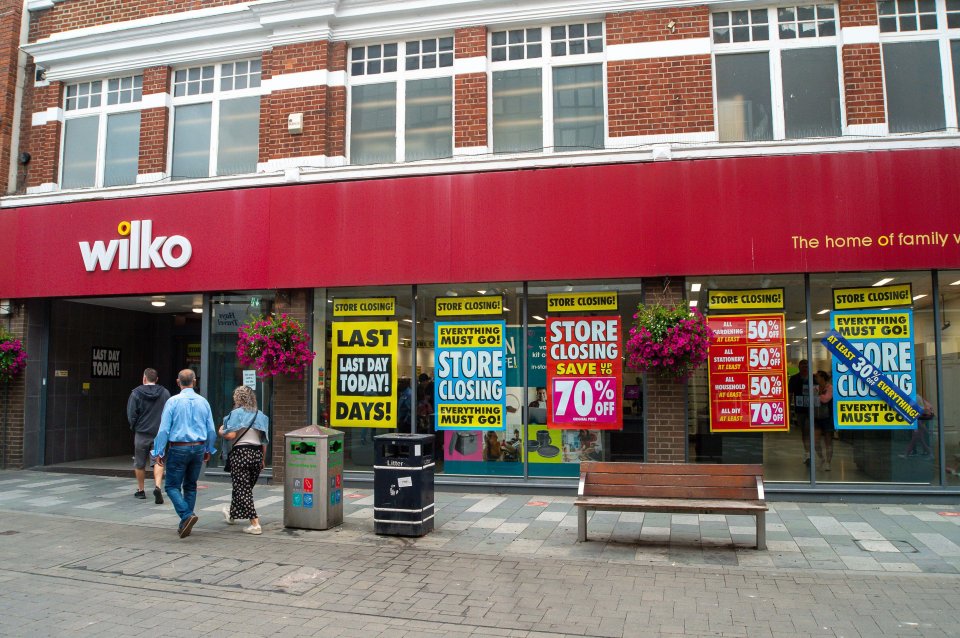 a wilko store with a red sign that says the home of family