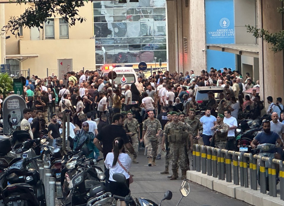 a crowd of people are gathered outside of the american university medical center