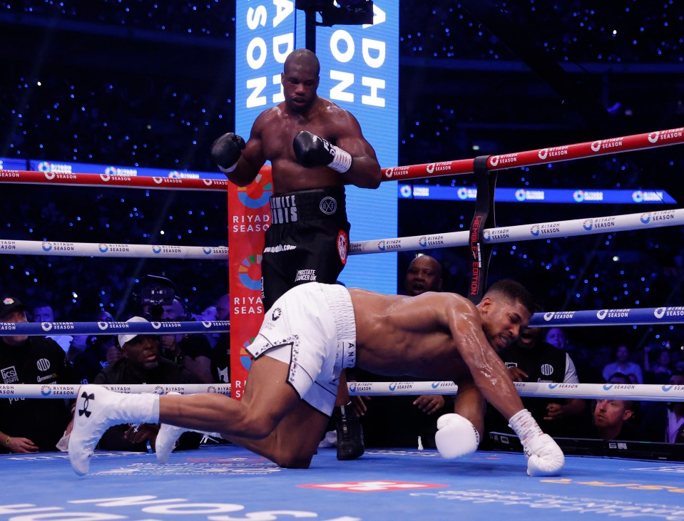 two boxers in a ring with a sign behind them that says riyadh season