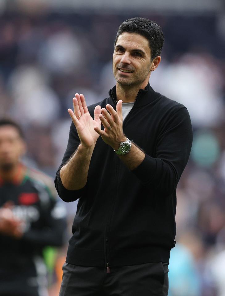 a man wearing a watch is clapping his hands