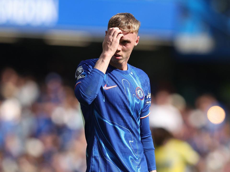 a soccer player wearing a blue shirt that says ' chelsea ' on it