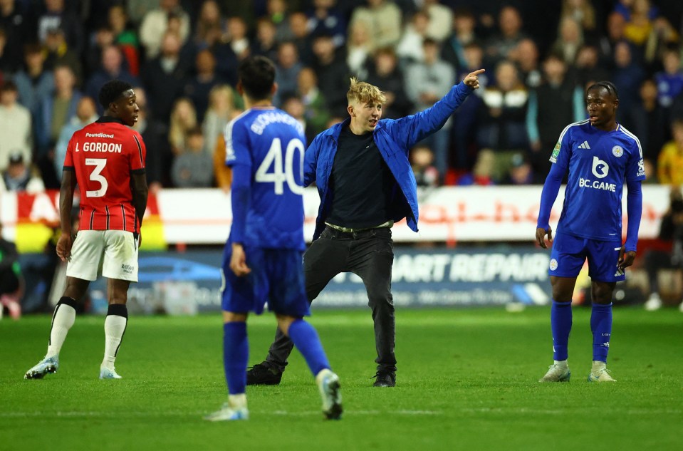 A fan ran onto the pitch and made a gesture