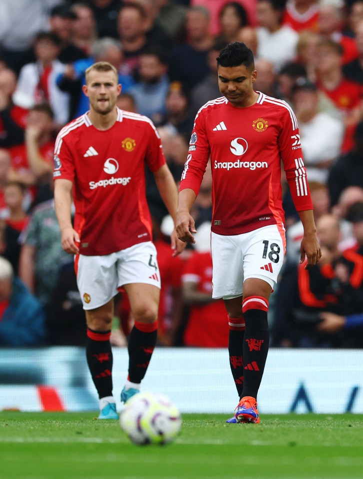 soccer players wearing snapdragon jerseys stand on the field