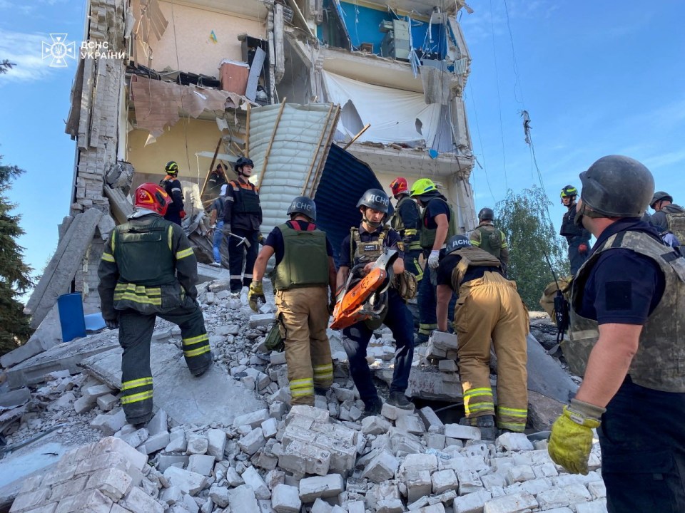 Rescuers work at the site of a Russian missile strike, amid Russia’s attack on Ukraine, in Kryvyi Rih, on Friday, September 27