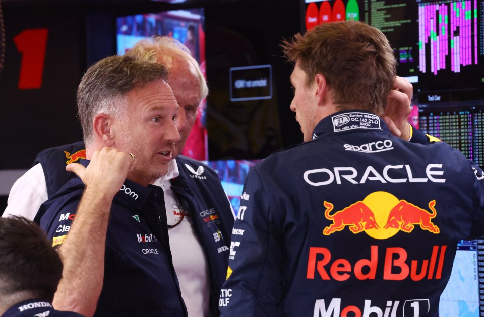 Max Verstappen in conversation with Christian Horner