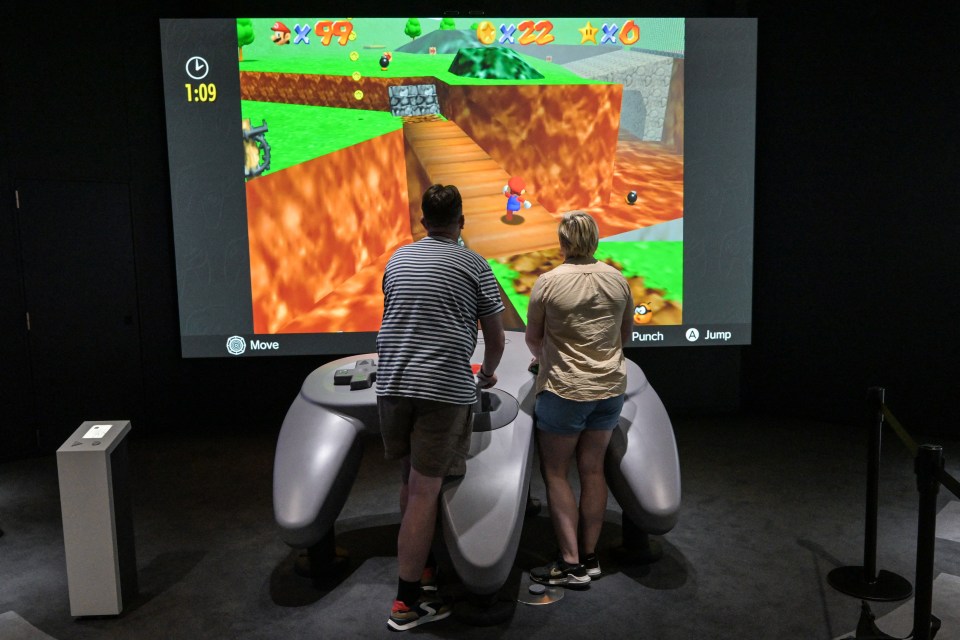 The oversized gadget is so big it takes two people to control retro games