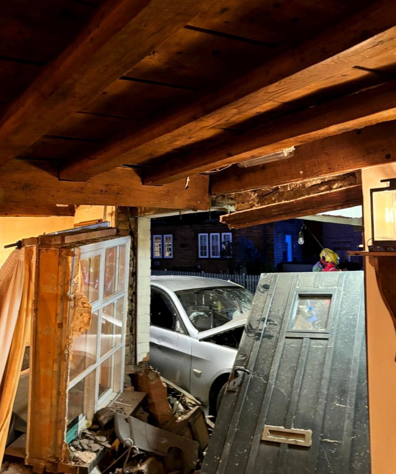 a car that has crashed into a house