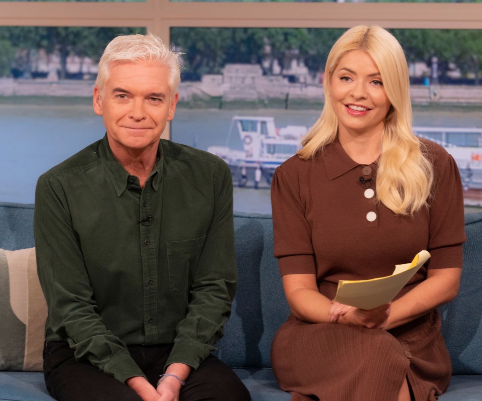 a man and a woman are sitting next to each other on a couch