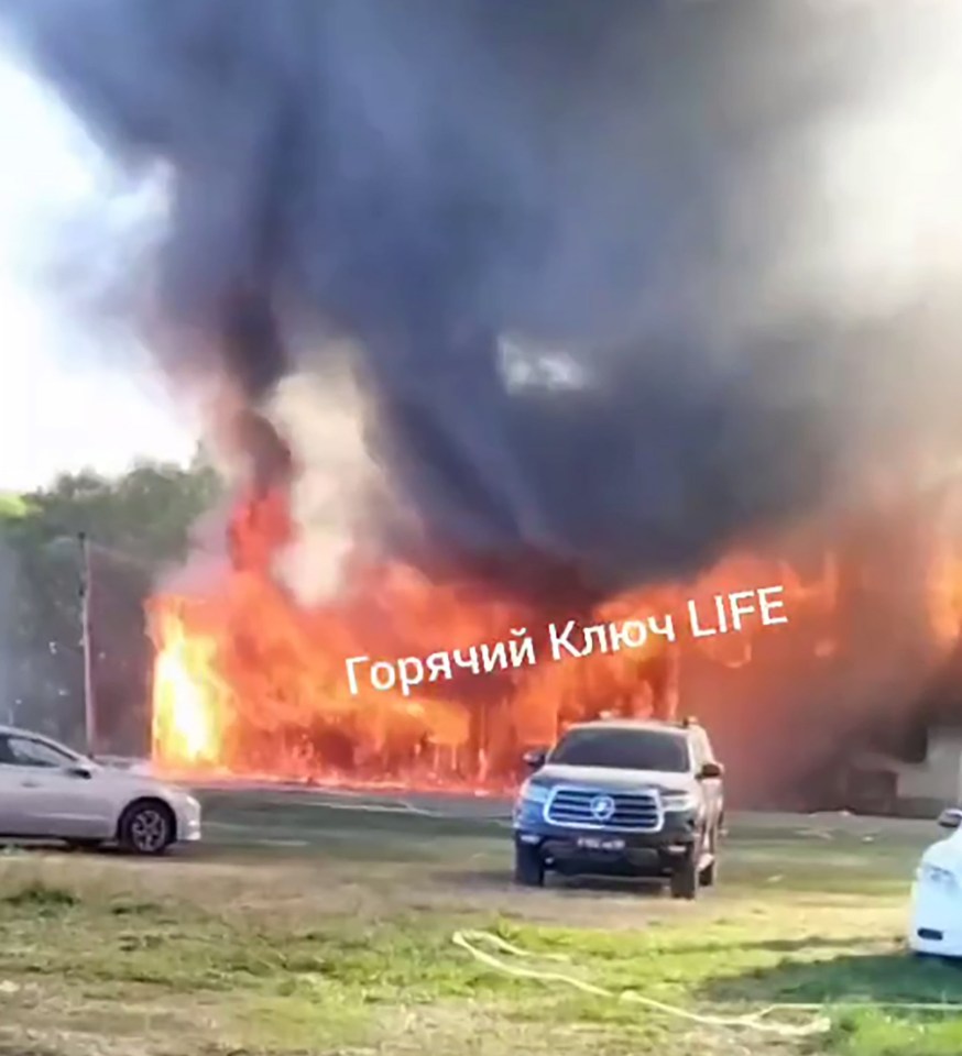 a toyota truck is parked in front of a large fire