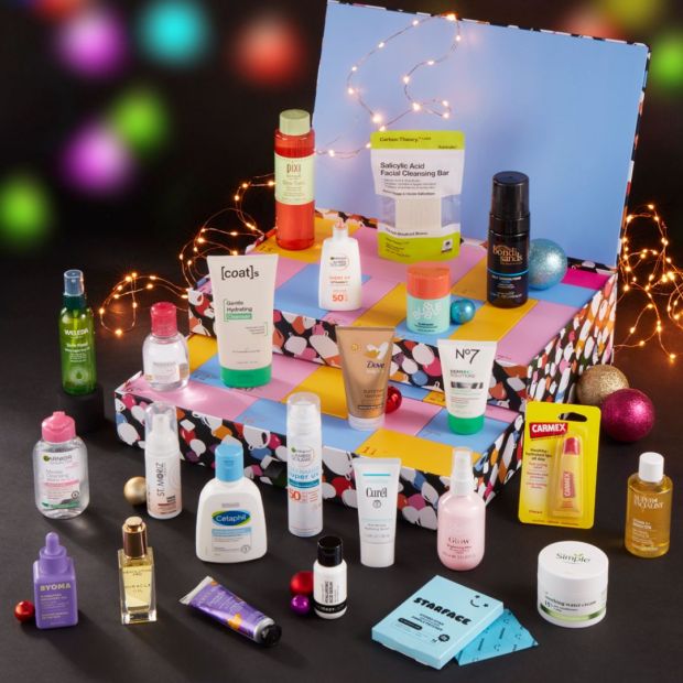 a box filled with various beauty products including a bottle of coast