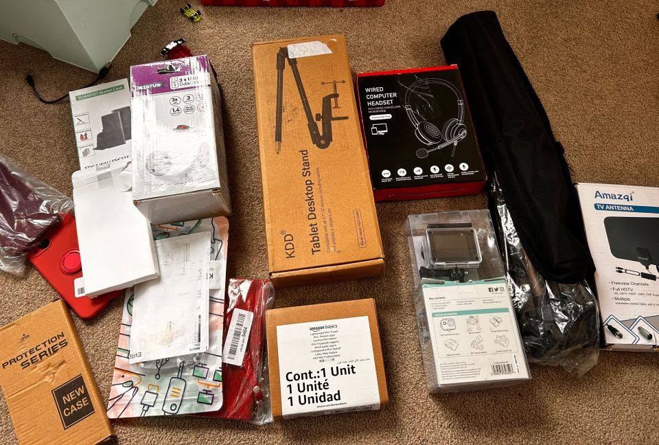 a bunch of boxes including one that says tablet desktop stand