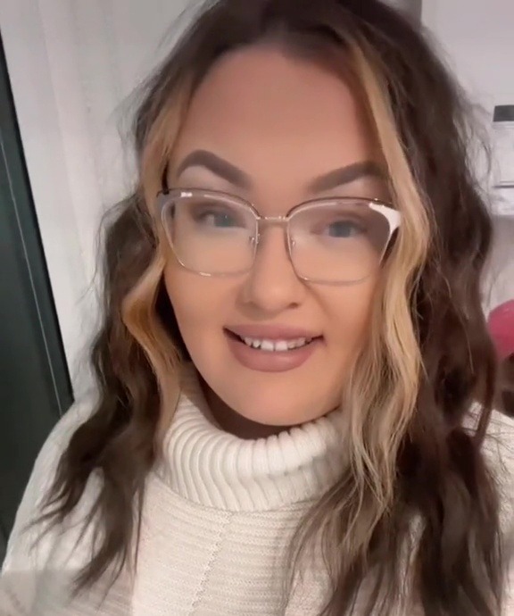 a woman wearing glasses and a white sweater says " using only one product changed my life "