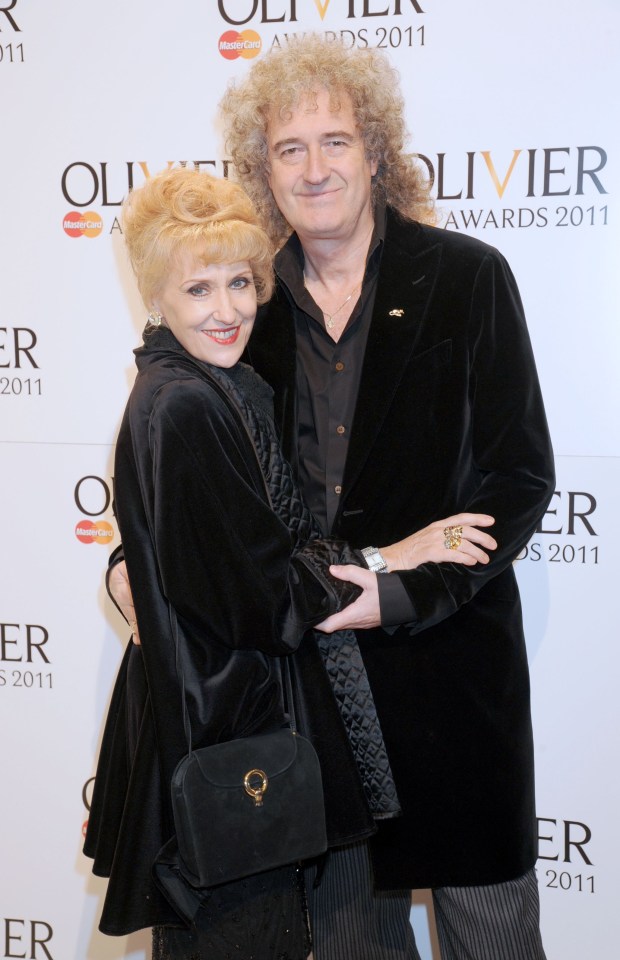 brian may and his wife pose for a photo at the olivier awards 2011