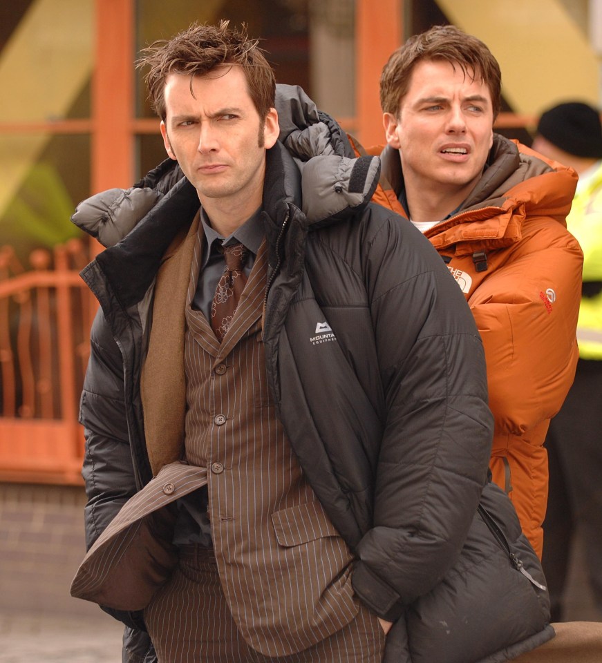 two men standing next to each other one wearing a mountain equipment jacket