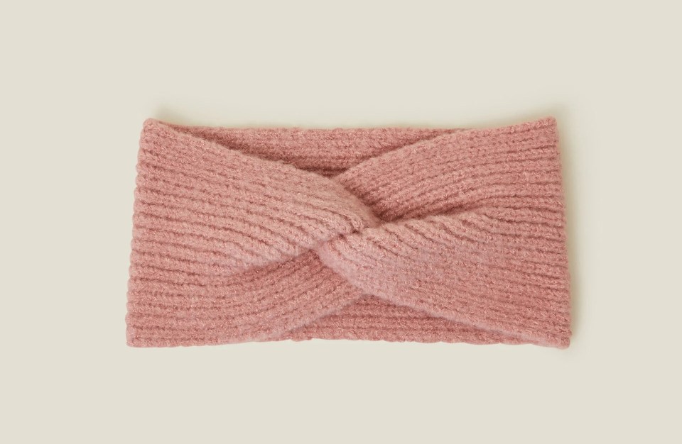 a pink headband with a knot in the middle