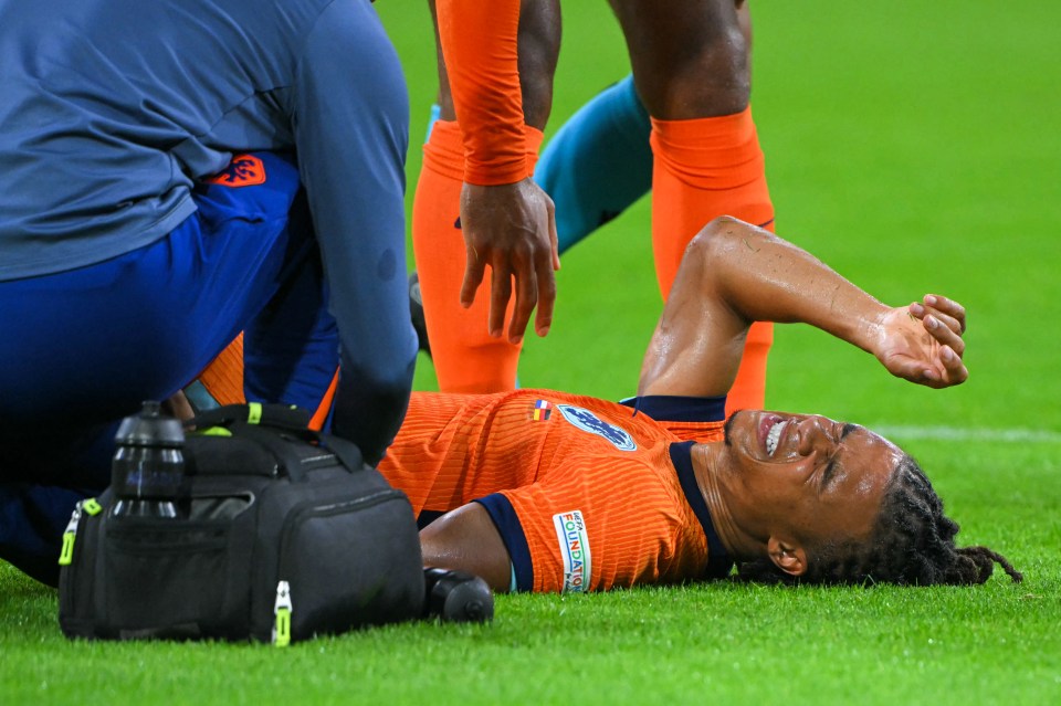 a soccer player laying on the field with a bag that says ' chicago ' on it