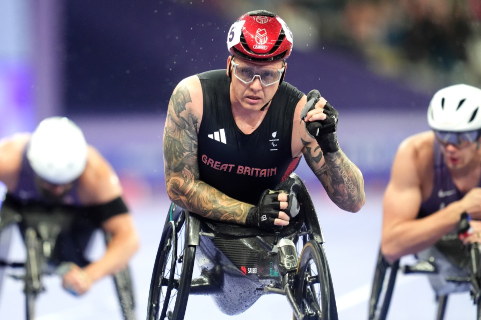 a man in a wheelchair is wearing a shirt that says great britain