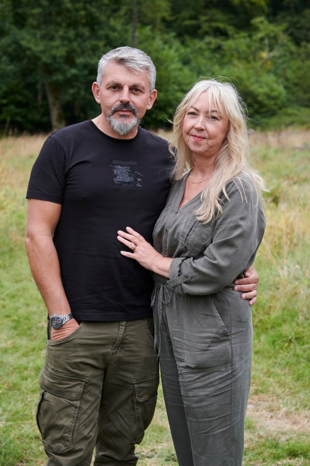 a man in a burberry shirt stands next to a woman