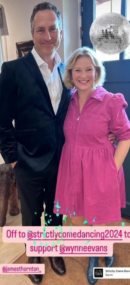 a man in a suit and a woman in a pink dress are standing next to each other