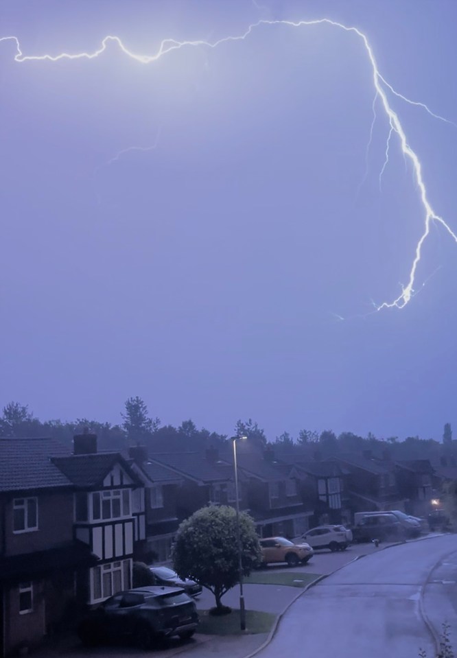 Lightning above houses in Great Oakley, Corby, Northamptonshire