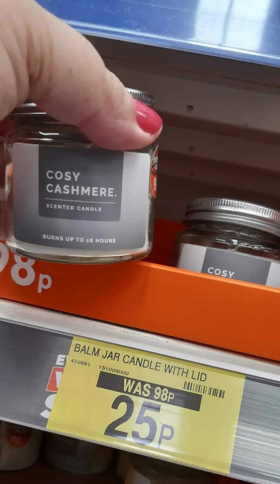 a person is holding a jar of cosy cashmere scented candle