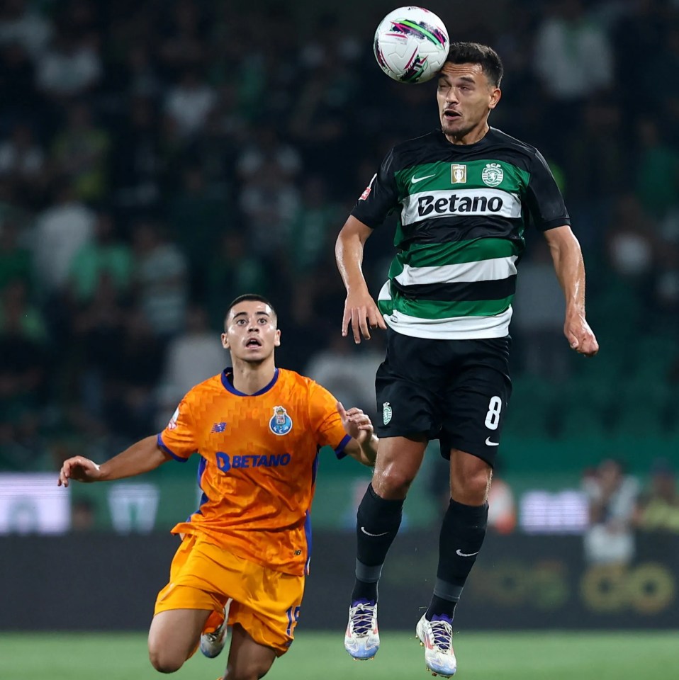 a soccer player wearing a betano jersey heads the ball