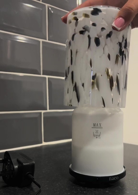 a naeco candle holder sits on a counter top