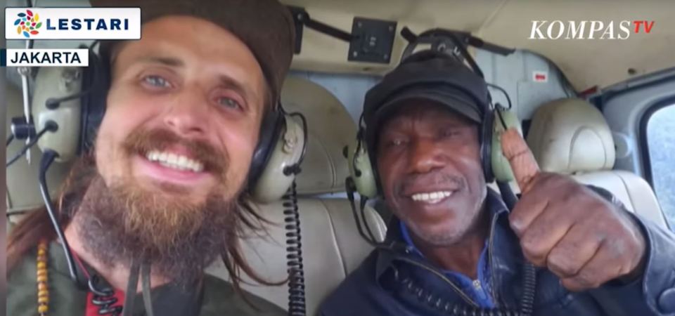 Mehrtens onboard a helicopter with a local official after his release