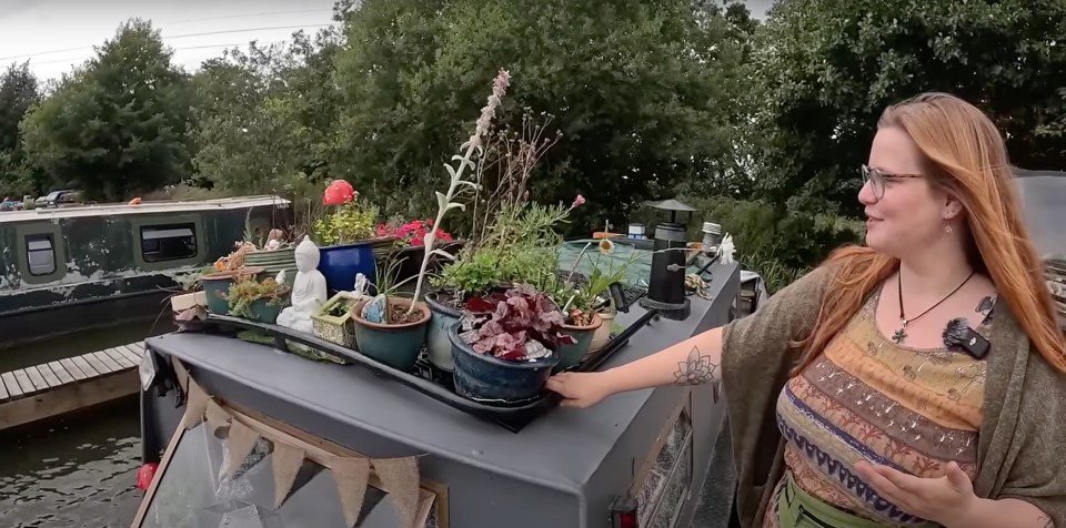 a video of a woman on a boat is titled 20ft micro narrowboat tour