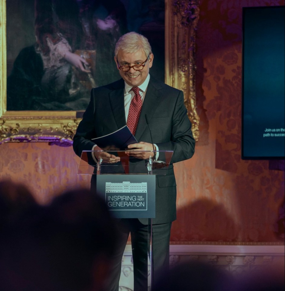 a man stands at a podium with a sign that says conference centre