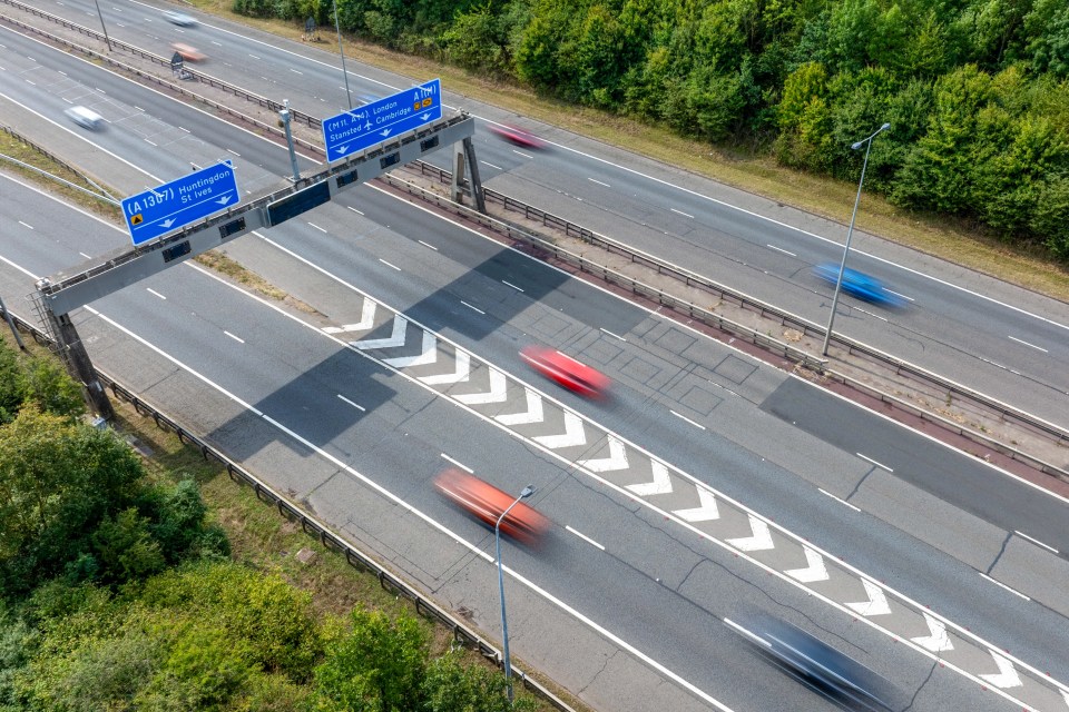 a highway with a blue sign that says a12