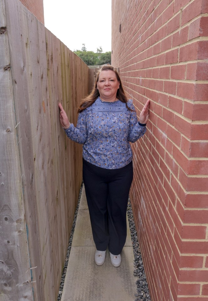 The nurse says she has been left with inadequate access to her rear garden